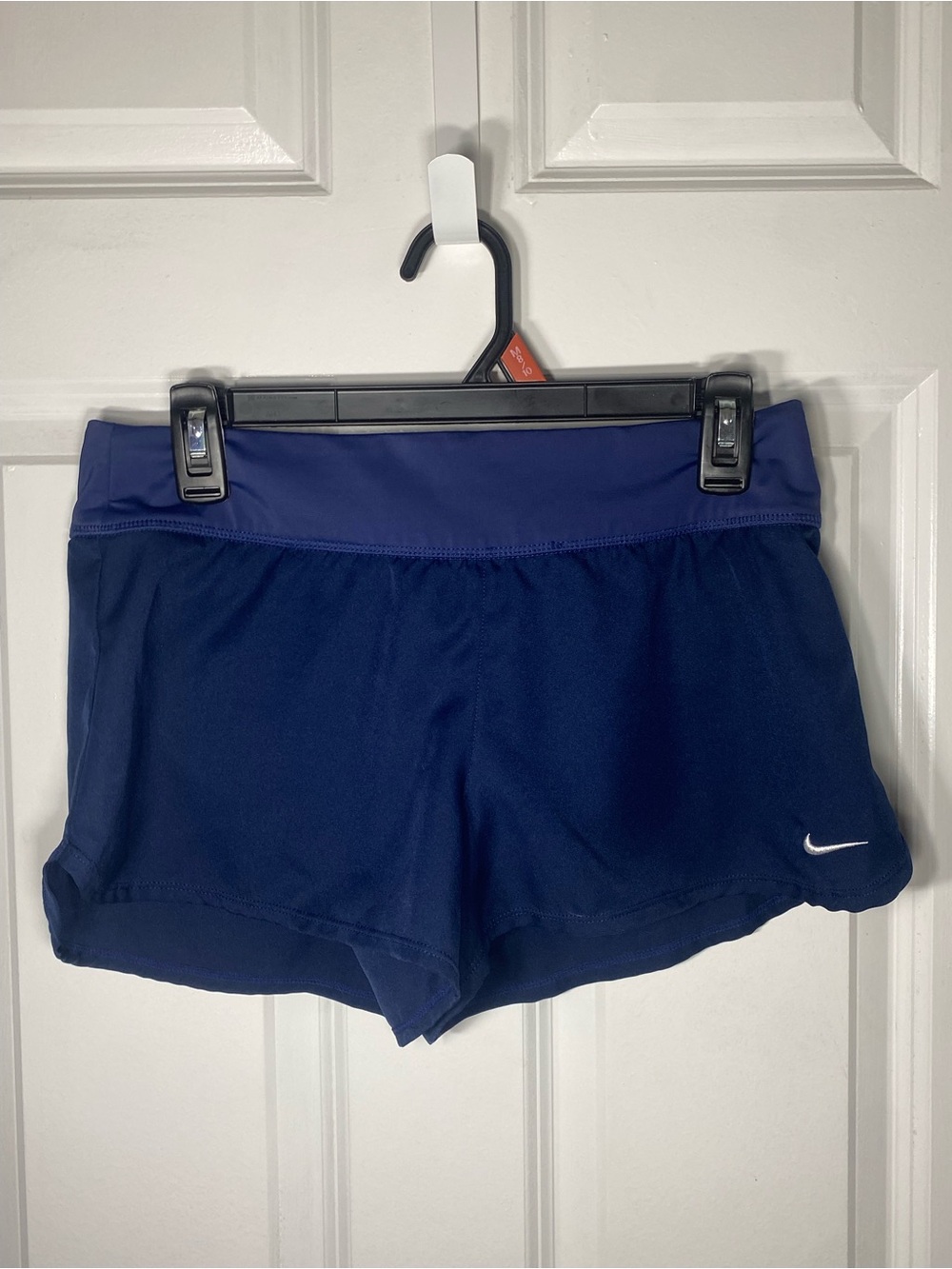 Nike Women’s Navy Blue Athletic Shorts with White Swoosh. Washed but never worn.